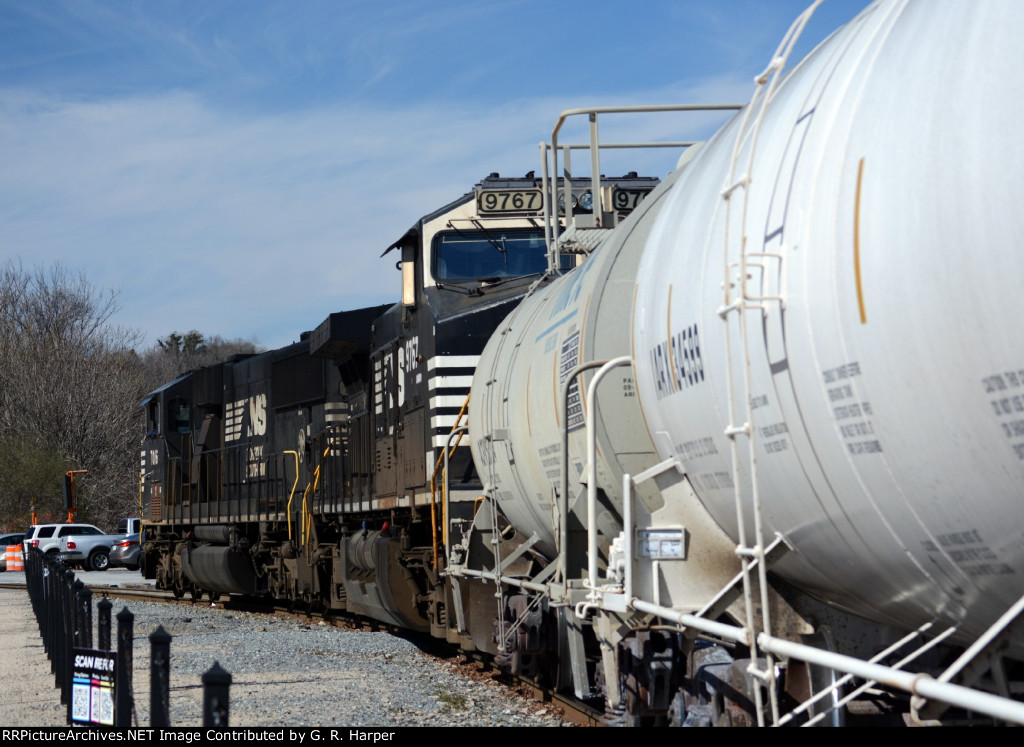 NS yard job E19 with interchange cars for CSX passes by the Depot Grille in downtown Lynchburg,